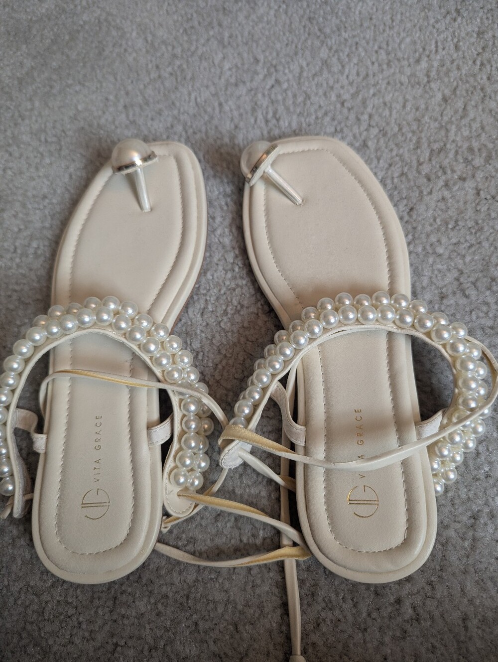 Vita Grace flat sandals featuring pearl-embellished ankle straps and toe post
